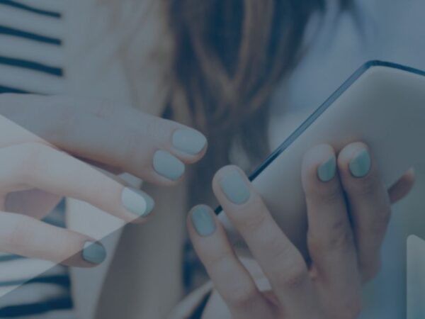 hands of a person holding a phone - turning customers into creators