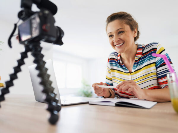 woman sitting in front of a camera