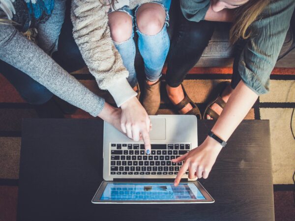 image of people pointing at a screen