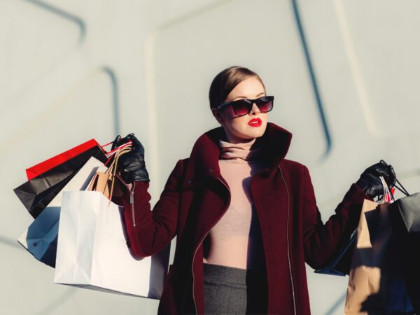 woman holding shopping bags