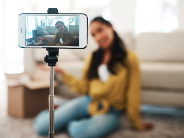 woman recording video on her phone