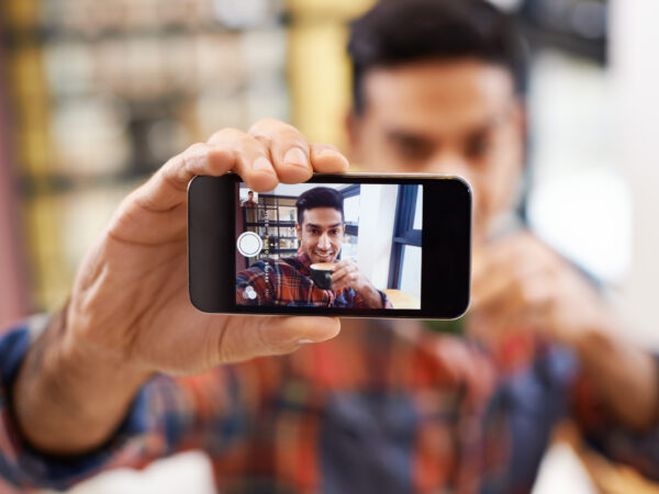 Man recording a video on a phone